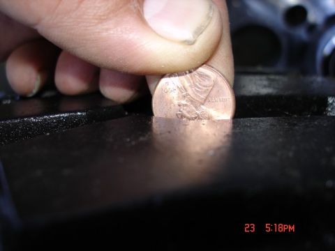 1985 Ford Bronco - A penny is used to measure the depth of the tire tread.