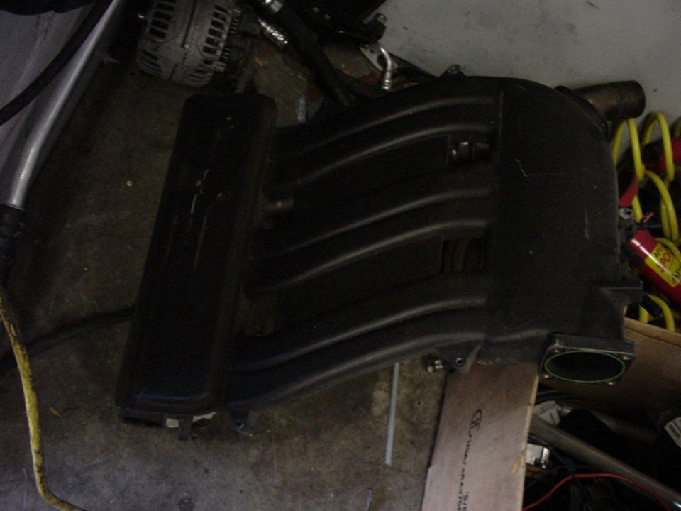 Black plastic intake manifold with ribbed runners