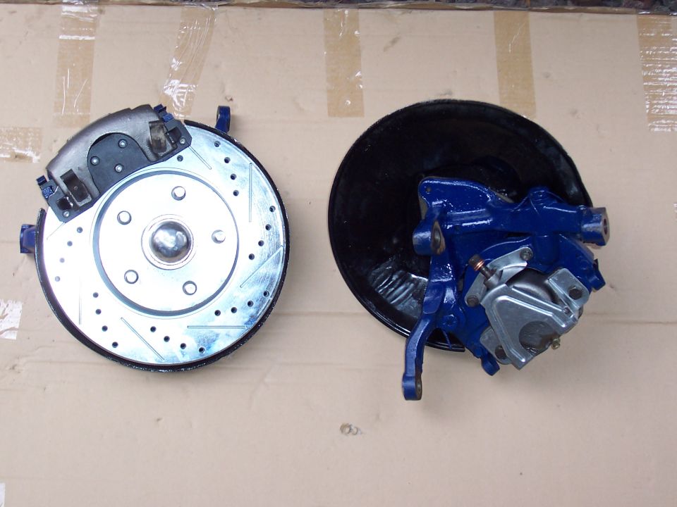 My newly rebuilt and painted front spindles and cross drilled and slotted rotors.