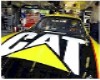 1993 Ford Bronco - A race car with CAT branding is seen from the front.