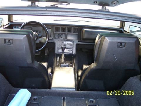 1994 Ford Bronco - The interior of a 1984 Chevrolet Corvette C4 features a digital dashboard and bucket seats.