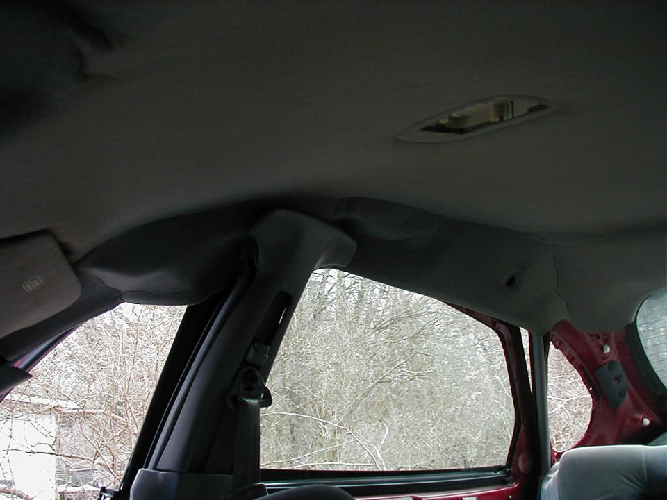 Interior view of a car's headliner and window frame