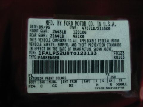 1997 Ford Taurus - A close-up of a vehicle's identification sticker shows its manufacturing date and VIN.