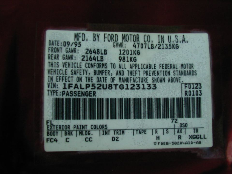 Vehicle identification sticker with manufacturing date 09/95 and VIN 1FALP52U8TG123133