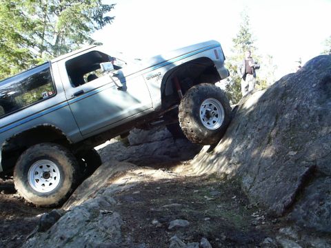 1984 Ford Bronco II - This 1984 Ford Bronco II navigates a challenging rocky terrain, its off-road capabilities.