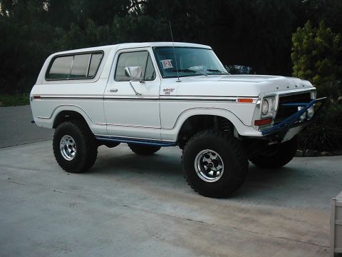 1978 Ford Bronco - White 1978 Ford Bronco with off-road tires and custom front bumper.