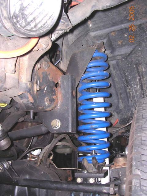 1994 Ford Bronco - the coil sits much better. Cage builds 4.25 degrees of caster into the arms to help the coil sit flatter. i am running 7 degree bushings up…
