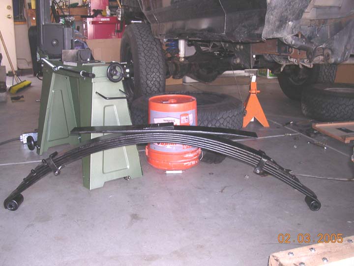 instead of moving the hangers or using blocks, I had a new main leaf made for my skyjacker rear springs.  It ended up requiring 3 new springs to work, but they gave me a modified military wrap which was nice for added strength