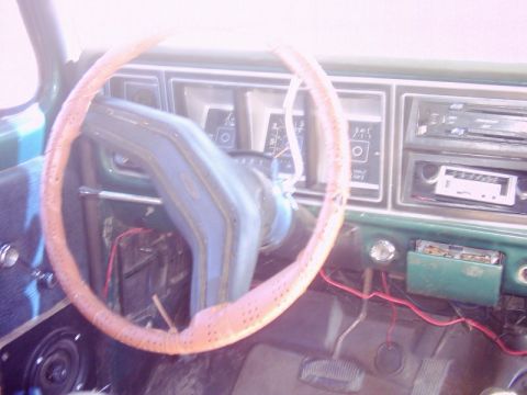1978 Ford Bronco - Interior view of a 1978 Ford Bronco, including the steering wheel and dashboard.