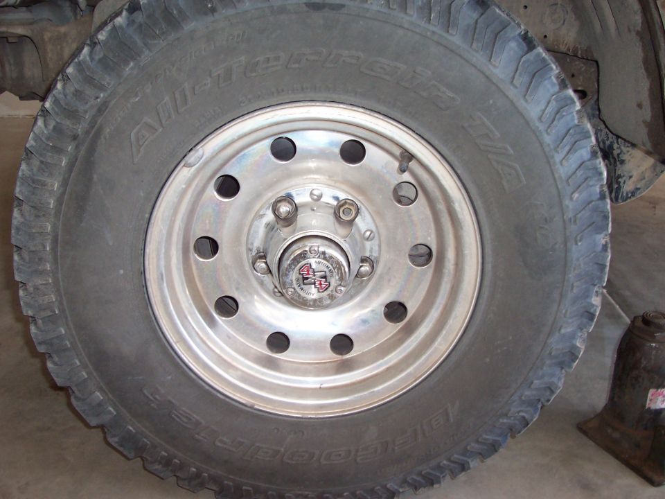 BFGoodrich All-Terrain tire on polished aluminum wheel with automatic 4x4 locking hub