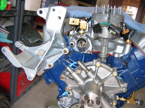 1992 Ford Bronco - Mounting the alternator bracket, with new grade 8 hardware. The spot for the smog pump will be vacant as I'm eliminating it for this build.