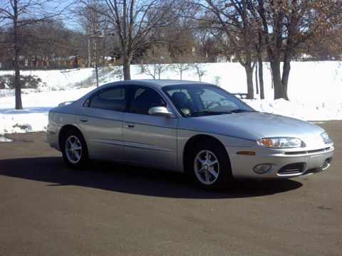 2002 Oldsmobile Aurora - Silver 2002 Oldsmobile Aurora sedan seen from a 3/4 front angle during winter.