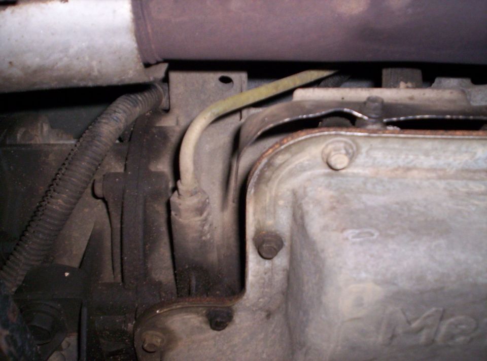 Engine transmission pan and exhaust pipe detail