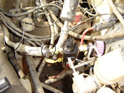 1991 Ford Bronco - Engine bay shows air compressor components and a JB Weld repair on a hose.