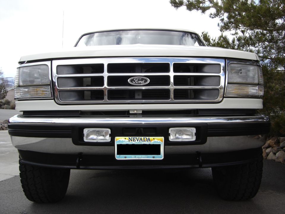 1995 Ford Bronco front view showing grille and headlights. Nevada license plate is visible