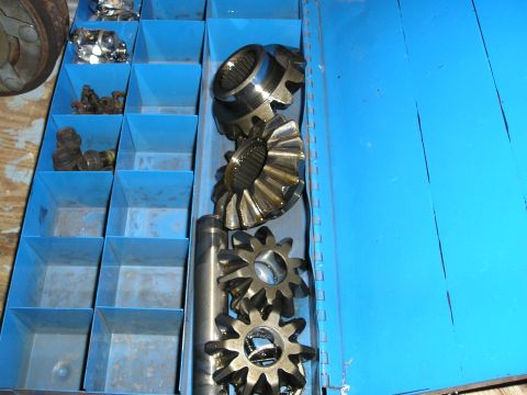 1996 Ford Bronco - Differential gears and bolts are organized in a blue toolbox.