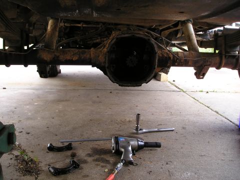 1996 Ford Bronco - The rear axle differential is exposed, with tools laid out for repair or maintenance.