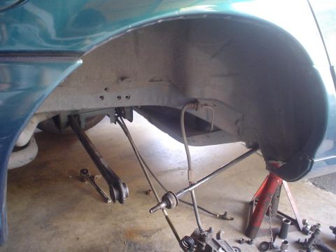 1993 Ford Taurus - The rear suspension of a 1993 Ford Taurus is shown with components removed for service.