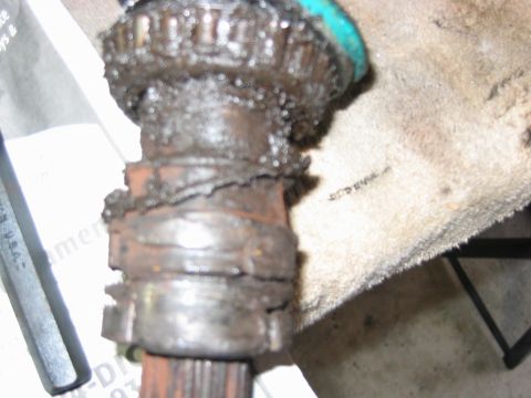 1992 Ford Bronco - This heavily greased and worn CV joint part shows significant wear and tear.