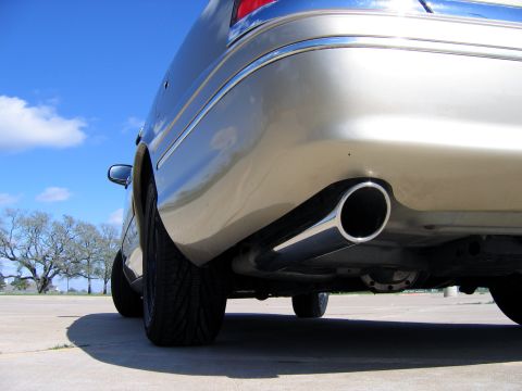 2000 Ford Crown Victoria - Rear view of a 2000 Ford Crown Victoria showing the exhaust pipe and quarter panel.