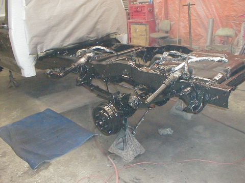 1991 Ford F-150 - The frame of a 1991 Ford F-150 is shown during a custom paint job flames.