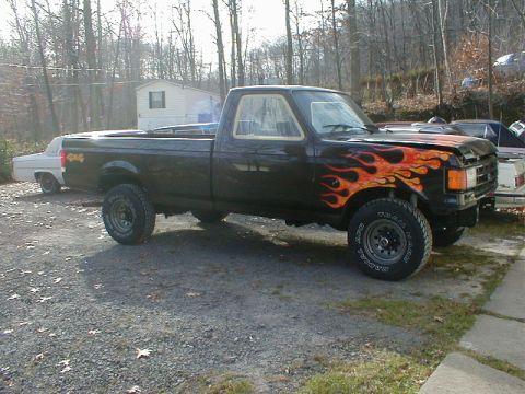 1991 Ford F-150 - This 1991 Ford F-150 features custom flame paintwork on its front end.