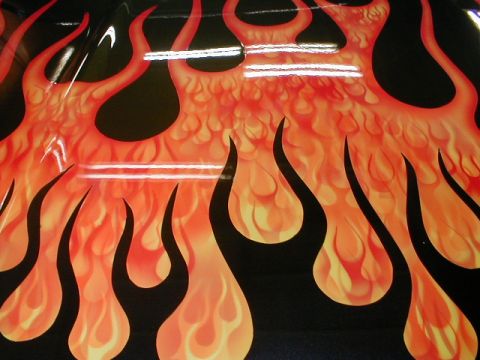 1991 Ford F-150 - Custom flame paint job covers the surface of this vehicle part.