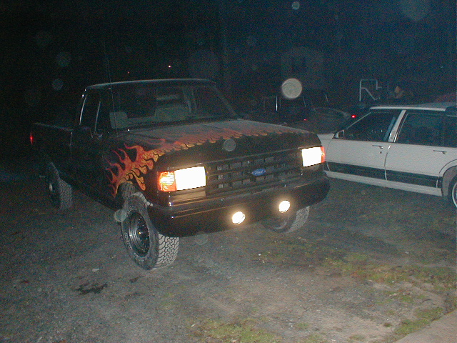 Black 1991 Ford F-150 with flame decals, 3q-front view