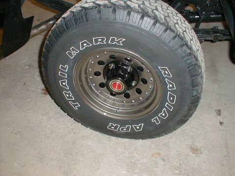 1991 Ford F-150 - A close-up view of a tire and wheel assembly, showing the tread pattern and sidewall markings.