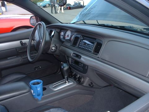 1999 Ford Crown Victoria - Interior view of a 1999 Ford Crown Victoria, the dashboard, steering wheel, and center console.