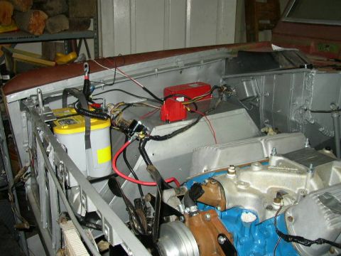 1995 Ford Bronco - Custom wiring and battery installation in an engine bay, with a V8 engine partially visible.