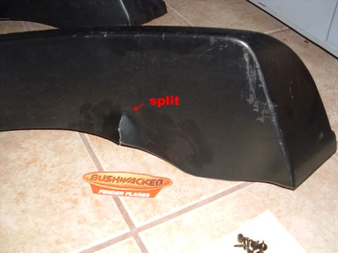 1993 Ford Bronco - A close-up shows a damaged Bushwacker fender flare with a noticeable split.