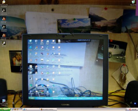 2000 Ford Crown Victoria - A white pickup truck is visible in a photograph pinned to a bulletin board.