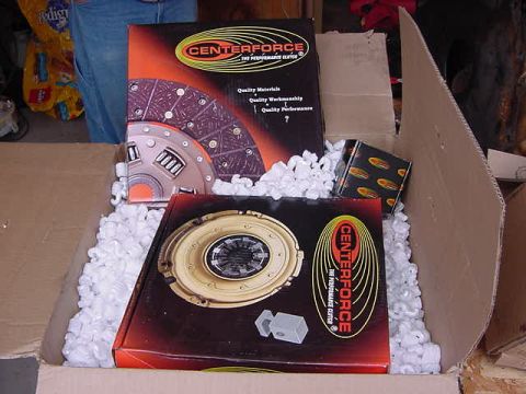 1995 Ford Bronco - Boxes of Centerforce clutch components are shown, packed in white foam peanuts inside a cardboard box.