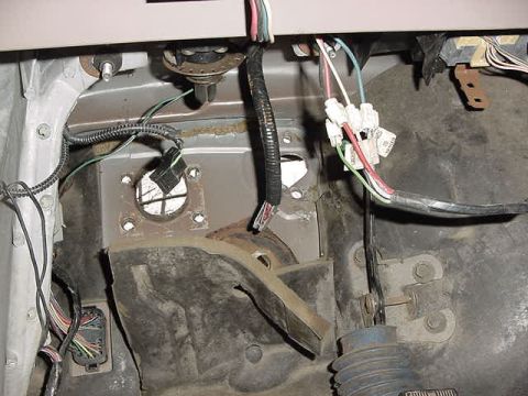 1995 Ford Bronco - Interior view of a vehicle's complex wiring harness and electrical connectors.