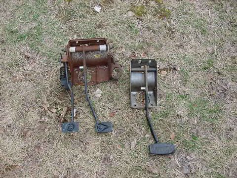 1995 Ford Bronco - Two sets of car pedals are shown on the ground, likely for a manual and automatic transmission.