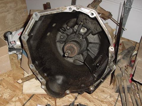 1995 Ford Bronco - Close-up of a transmission bell housing, likely removed from a vehicle.