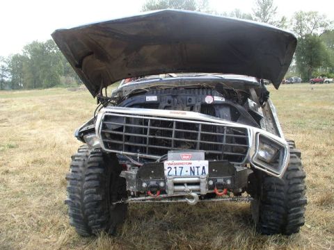 1979 Ford Bronco - This heavily modified 1978 Ford Bronco is shown with its hood open and oversized tires.
