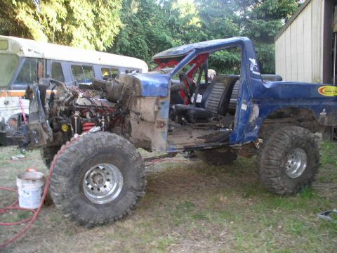 1979 Ford Bronco - This heavily modified Ford Bronco appears to be undergoing extensive restoration or customization, with its engine exposed and body panels…