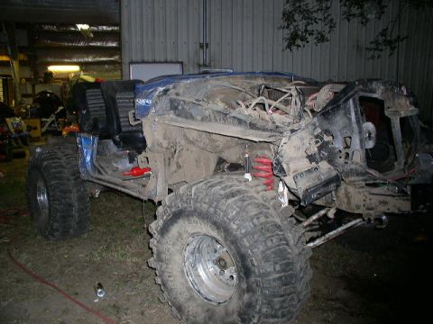 1979 Ford Bronco - This heavily modified vehicle appears to be undergoing significant reconstruction or repair.