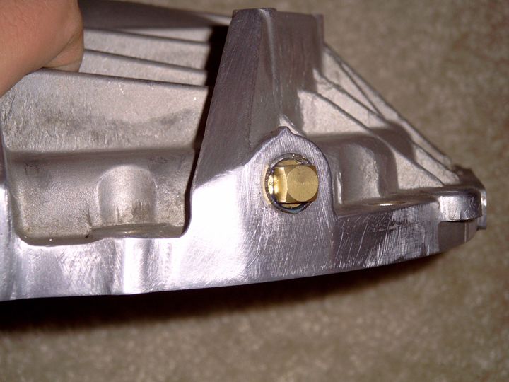 The vent hole on the Explorer is on the cover. Taped the hole with a 1/4" NPT 18 tooth Tap and sealed it with a brass plug and blue thread sealant.