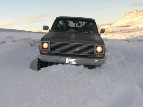 2001 Jeep Wrangler - This truck appears to be stuck in a snowy landscape, with its front end buried in snow.