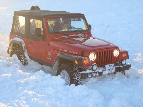 2001 Jeep Wrangler - This 2001 Jeep TJ Rubicon is stuck in a snowy landscape.