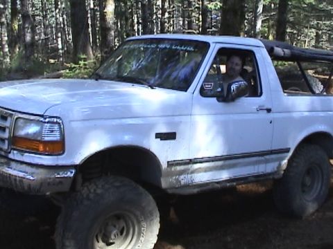 1994 Ford Explorer - White Ford Bronco with a "NOO CLUB" sticker on the windshield is seen off-road.