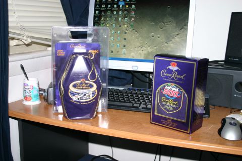 1989 Ford Bronco - Desk setup Crown Royal Daytona 500 limited edition bottle and box next to a computer.