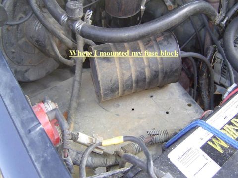 1993 Ford Bronco - Custom fuse block installation in the engine bay, with visible wiring and battery.