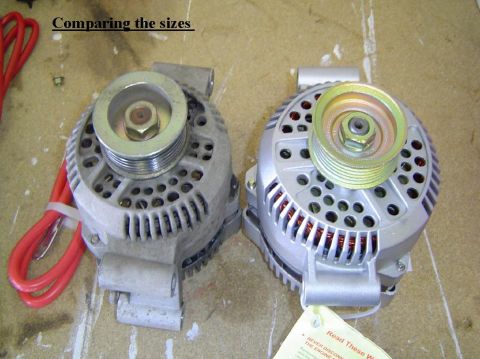 1993 Ford Bronco - Comparing the sizes of two alternators, one appears older than the other.