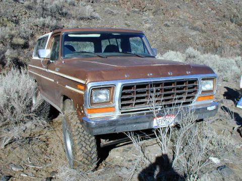 1978 Ford Bronco - This 1978 Ford Bronco is seen off-roading in a dry, brushy environment, showing its front 3/4 view.