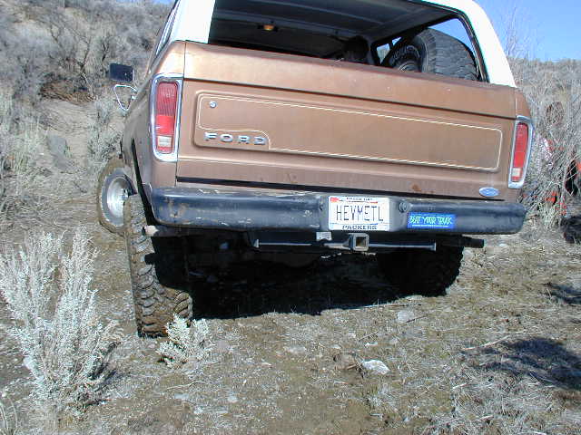 1978 Ford Bronco rear view, brown exterior, spare tire visible inside
