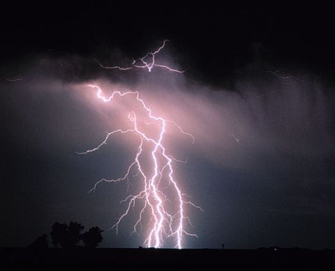 1983 Ford Bronco - Powerful lightning bolts crack through the night sky during a severe thunderstorm.
